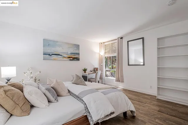 a bedroom with a bed and a window