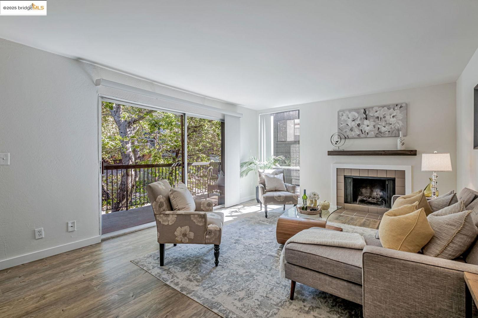 2700 Le Conte Avenue, Unit 301 Berkeley, CA 94709 - Photo 4 of 22 a living room with furniture and a fireplace
