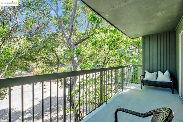a balcony with wooden floor