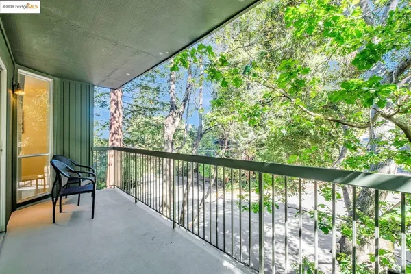 a view of balcony with furniture