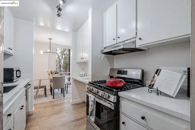 a kitchen with a stove and cabinets