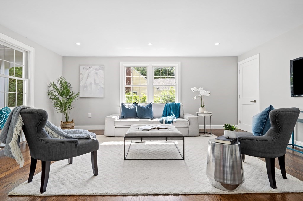a living room with furniture and a large window