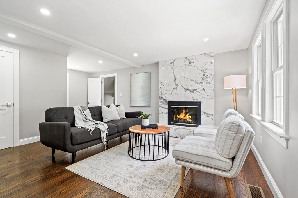 19 Cold Spring Road, Unit S North Reading, MA 01864 - Photo 12 of 30 a living room with furniture and a fireplace