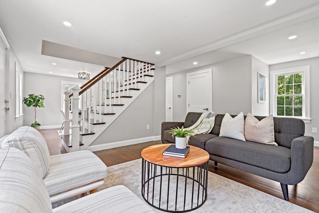 19 Cold Spring Road, Unit S North Reading, MA 01864 - Photo 14 of 30 a living room with furniture and a chandelier