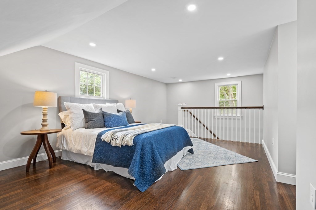 19 Cold Spring Road, Unit S North Reading, MA 01864 - Photo 16 of 30 a bed sitting in a spacious bedroom next to a window