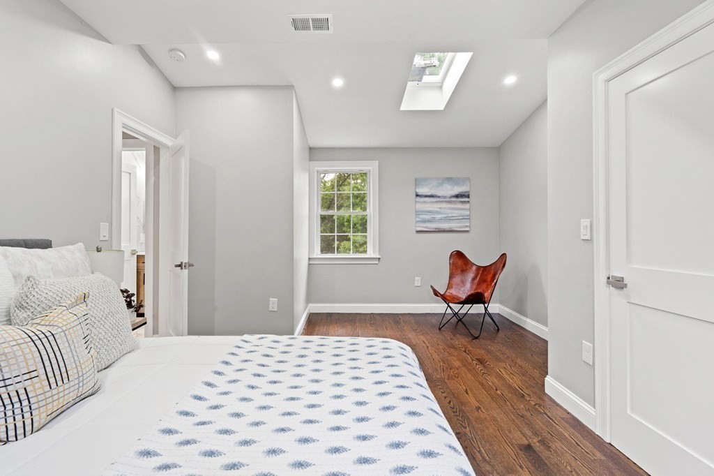 19 Cold Spring Road, Unit S North Reading, MA 01864 - Photo 19 of 30 a bedroom with a bed and a chair