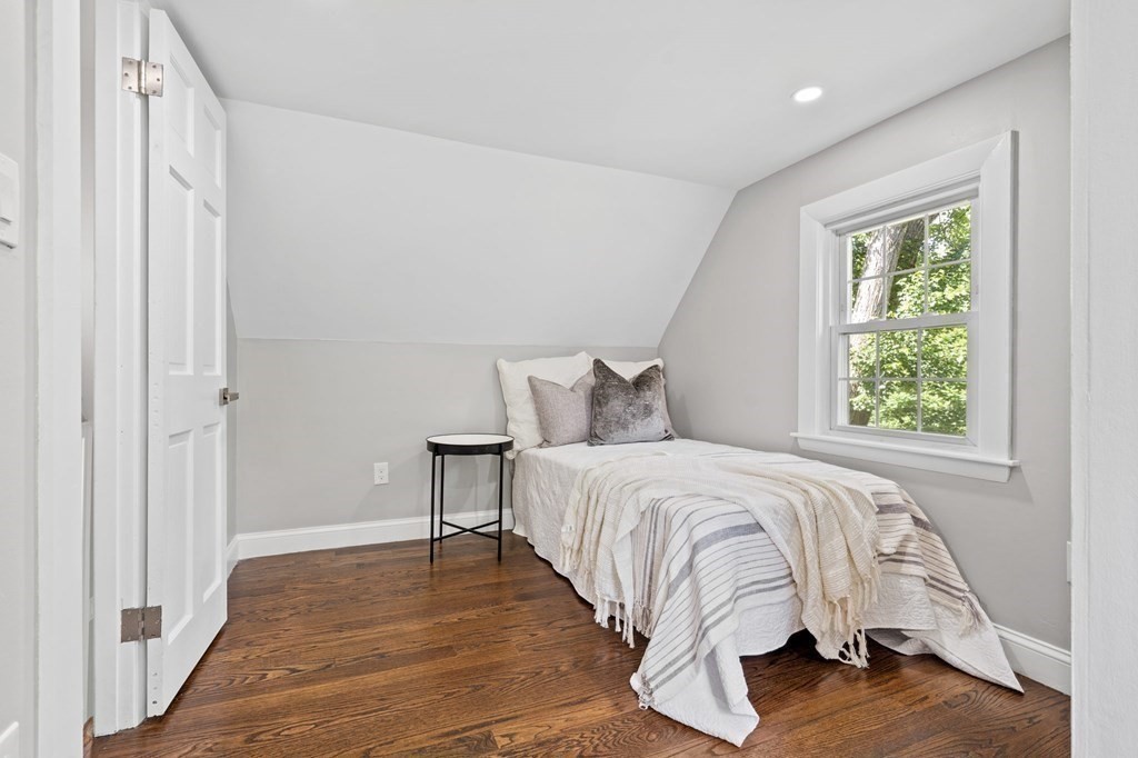 19 Cold Spring Road, Unit S North Reading, MA 01864 - Photo 20 of 30 a bed sitting in a bedroom next to a window