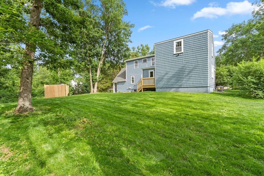 19 Cold Spring Road, Unit S North Reading, MA 01864 - Photo 28 of 30 a view of a house with a yard
