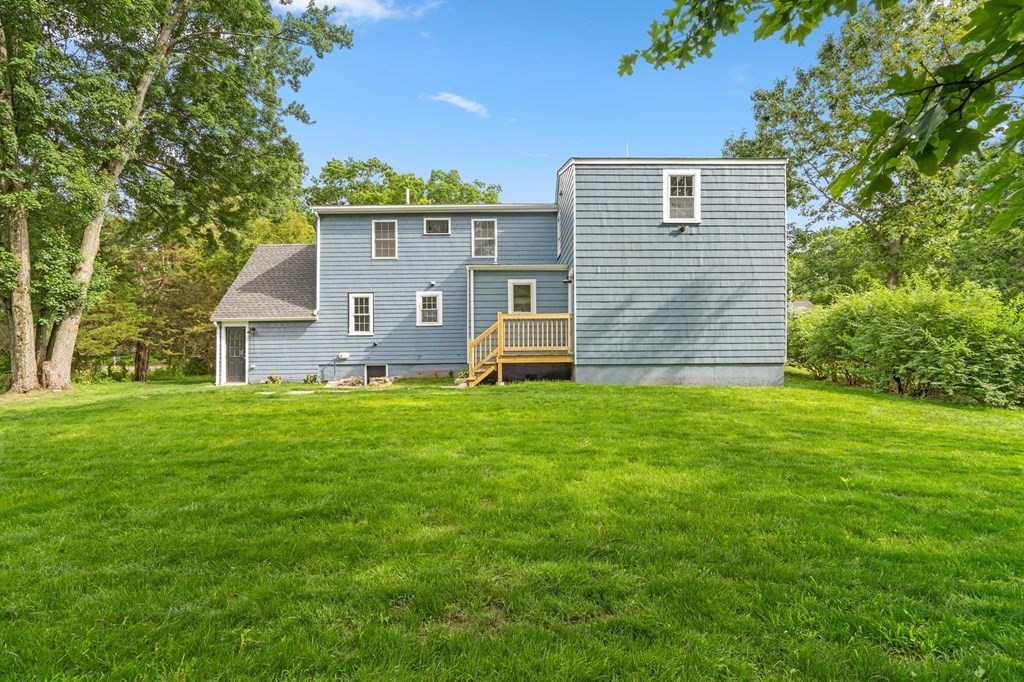 19 Cold Spring Road, Unit S North Reading, MA 01864 - Photo 29 of 30 a front view of a house with garden