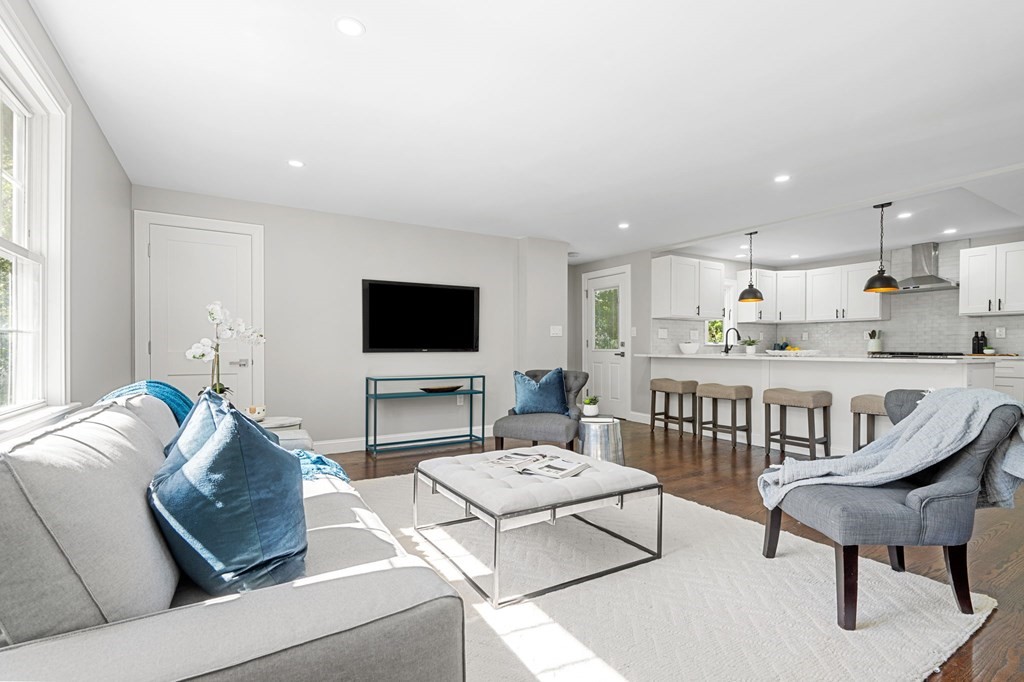 19 Cold Spring Road, Unit S North Reading, MA 01864 - Photo 4 of 30 a living room with furniture and a flat screen tv
