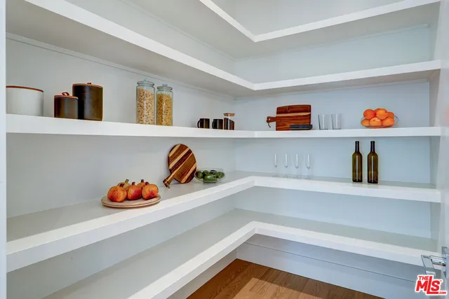 a view of kitchen cabinets and wooden floor