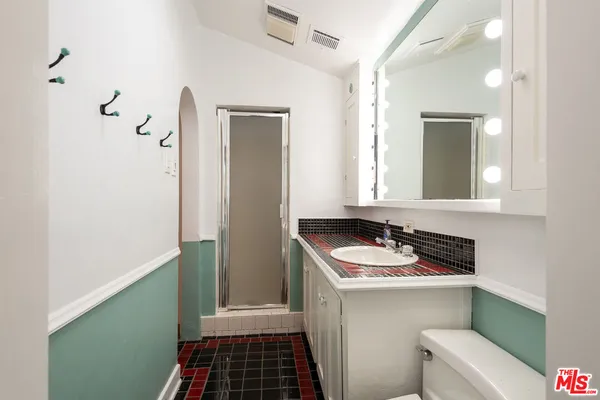 a bathroom with a sink and a mirror