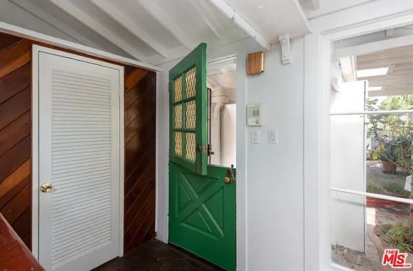a view of a door and chair in a room