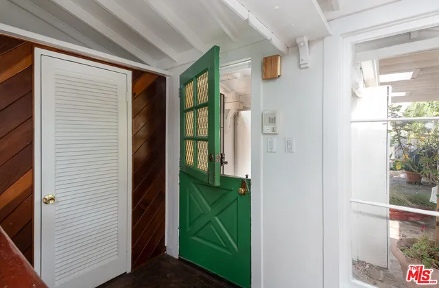 a view of a door and chair in a room