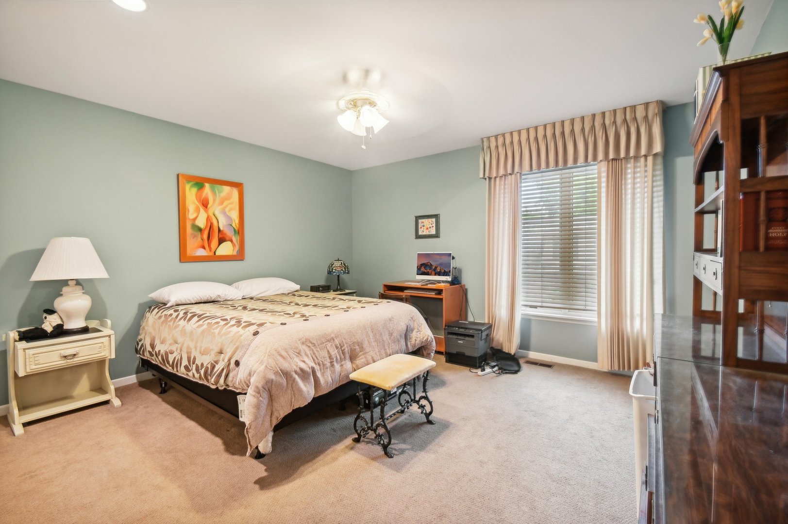 1551 Winnetka Road Glenview, IL 60025 - Photo 11 of 28 a bedroom with a bed and a chandelier