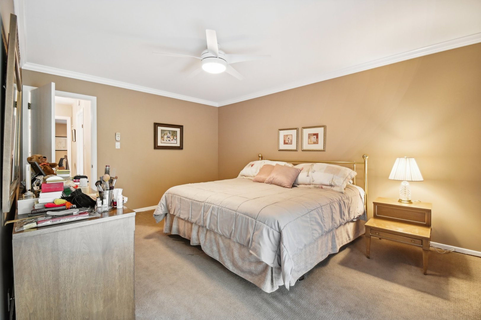 1551 Winnetka Road Glenview, IL 60025 - Photo 12 of 28 a bedroom with a bed and a chandelier