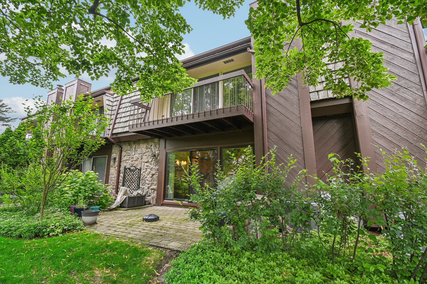 1551 Winnetka Road Glenview, IL 60025 - Photo 22 of 28 a view of a couches in front of house and trees
