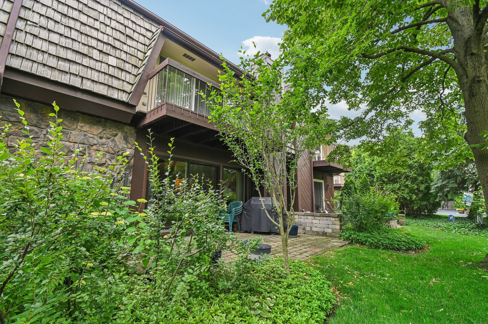 1551 Winnetka Road Glenview, IL 60025 - Photo 25 of 28 a front view of a house with a yard