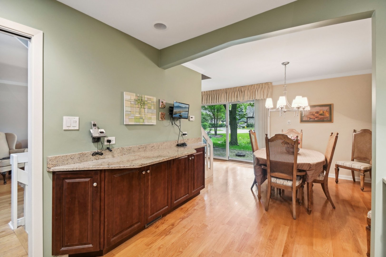 1551 Winnetka Road Glenview, IL 60025 - Photo 6 of 28 a view of a dining room with furniture and wooden floor