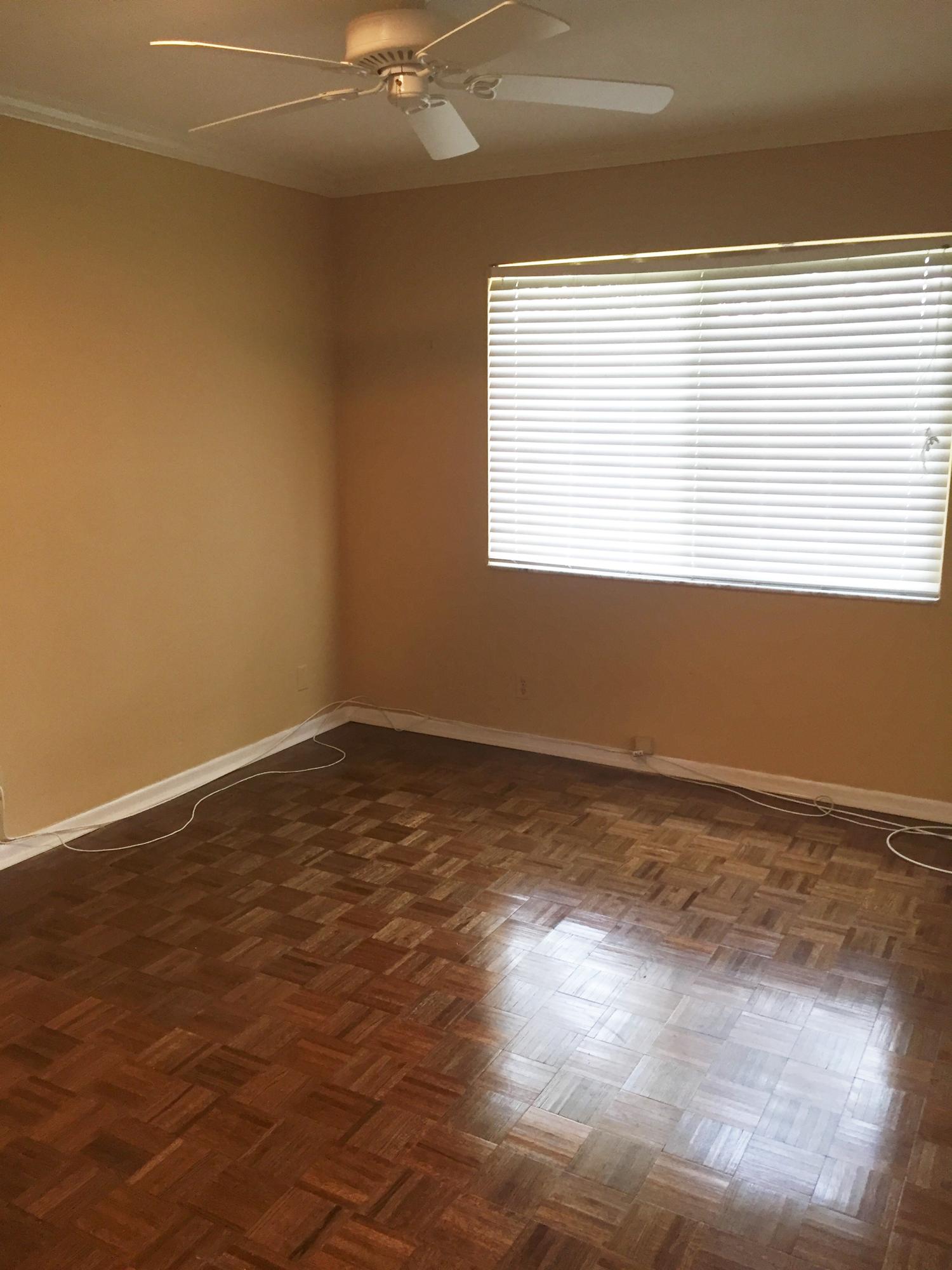 1200 Southwest 15th Street Boca Raton, FL 33486 - Photo 11 of 18 a view of an empty room with wooden floor and a window