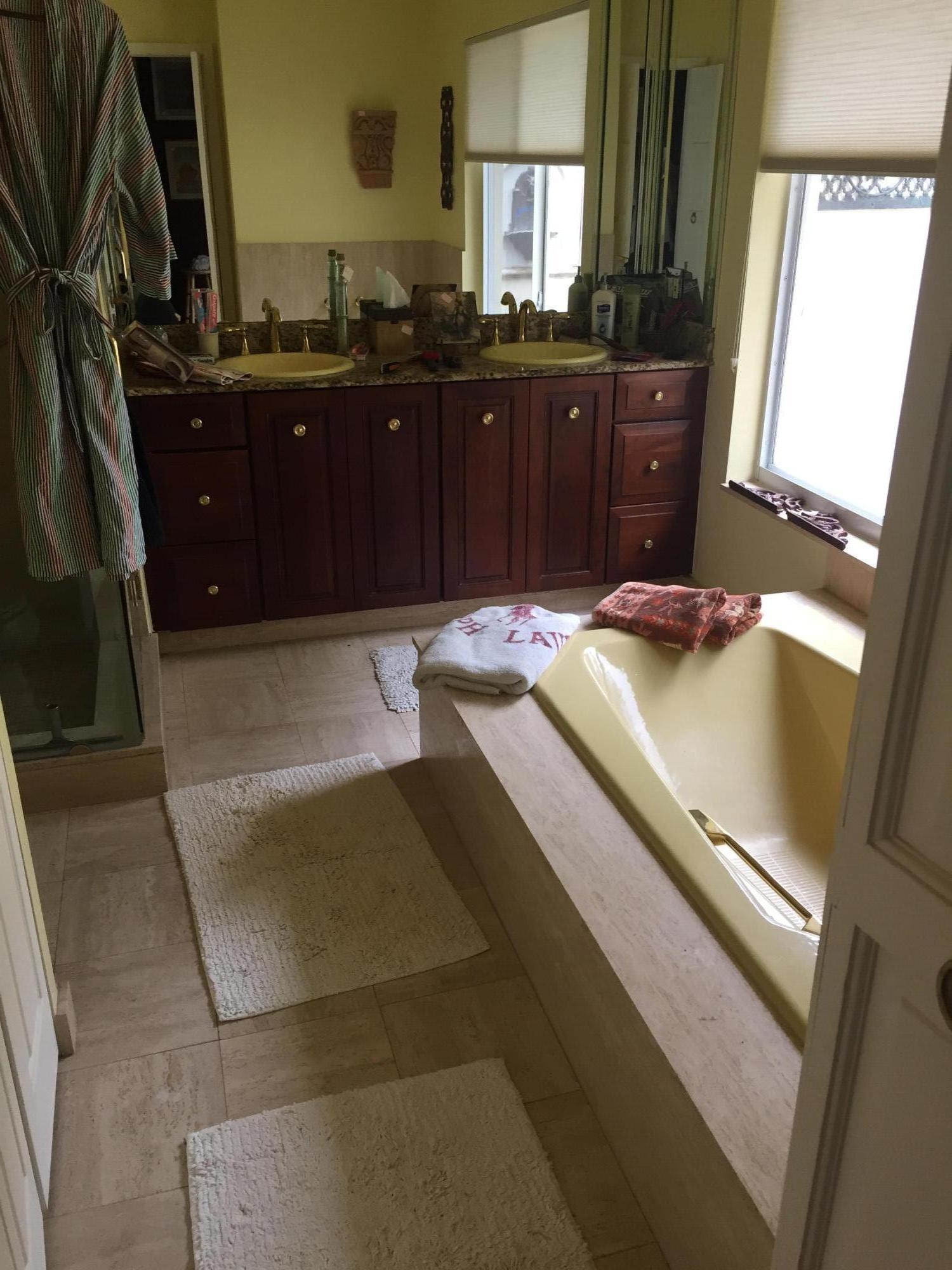 1200 Southwest 15th Street Boca Raton, FL 33486 - Photo 17 of 18 a bathroom with a granite countertop sink a mirror and vanity