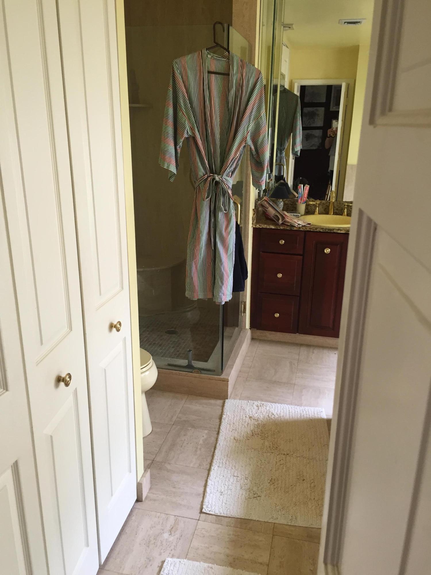 1200 Southwest 15th Street Boca Raton, FL 33486 - Photo 18 of 18 a bathroom with a sink a mirror and shower