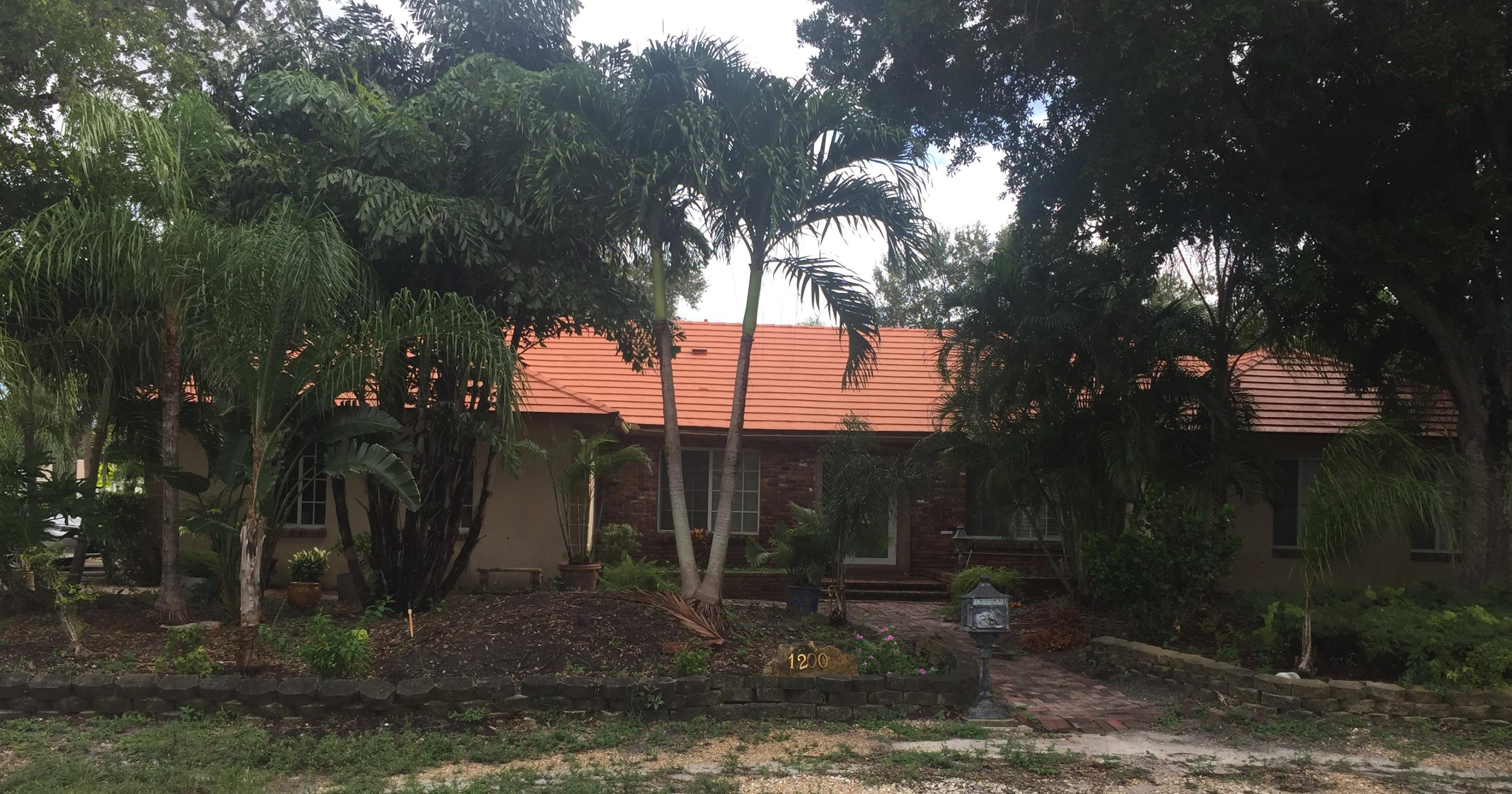 1200 Southwest 15th Street Boca Raton, FL 33486 - Photo 2 of 18 a backyard of a house with lots of green space