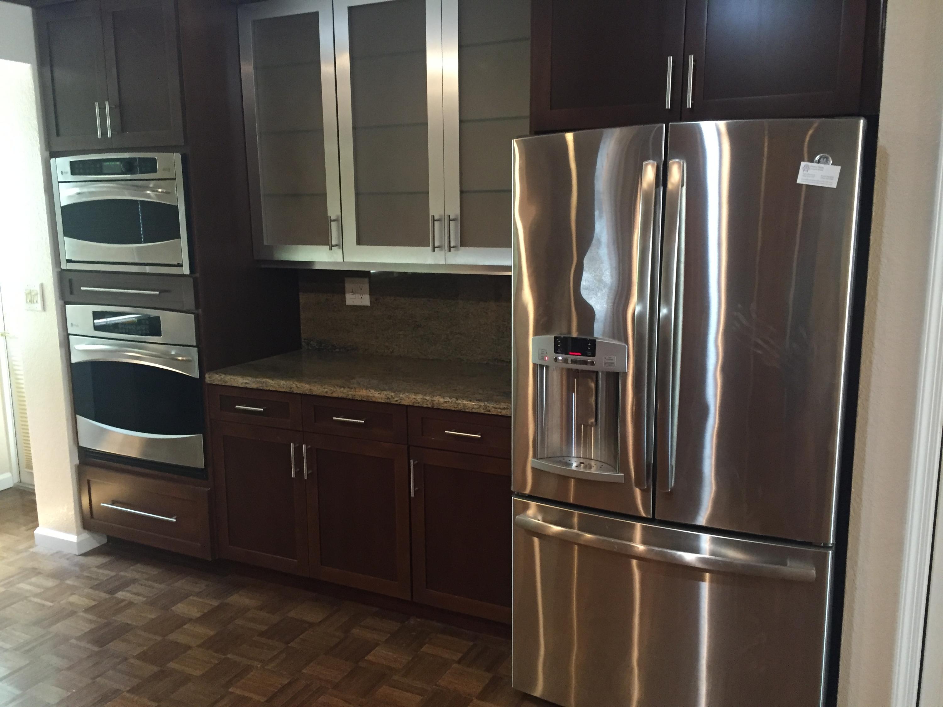 1200 Southwest 15th Street Boca Raton, FL 33486 - Photo 5 of 18 a kitchen with metallic refrigerator and cabinets