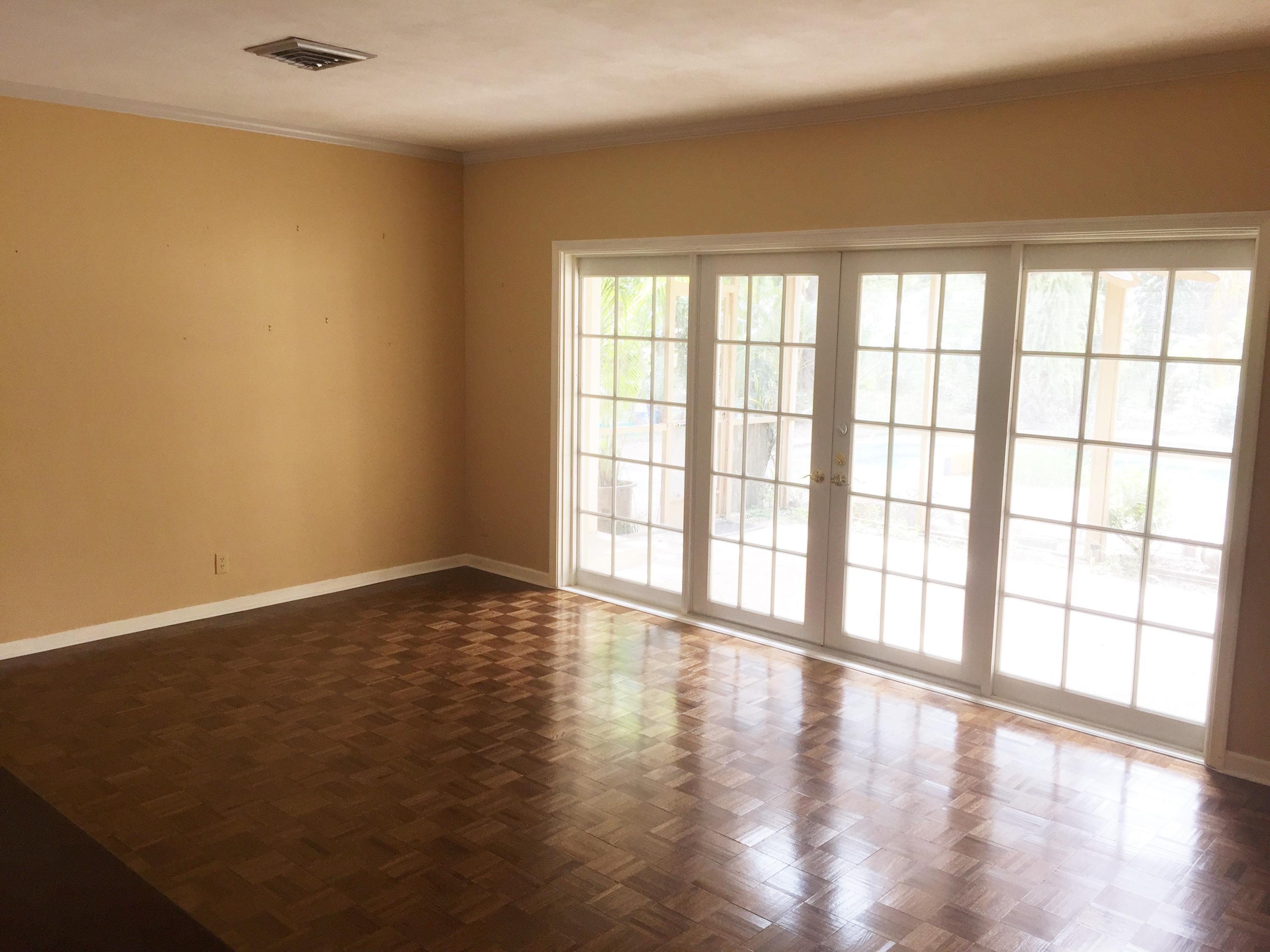 1200 Southwest 15th Street Boca Raton, FL 33486 - Photo 7 of 18 a view of an empty room with wooden floor and a window