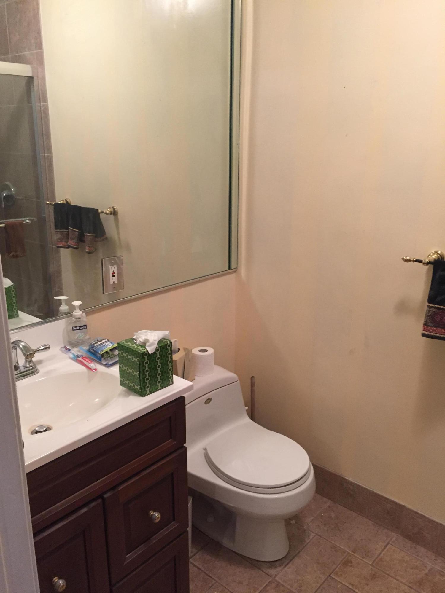 1200 Southwest 15th Street Boca Raton, FL 33486 - Photo 9 of 18 a bathroom with a sink a toilet and mirror