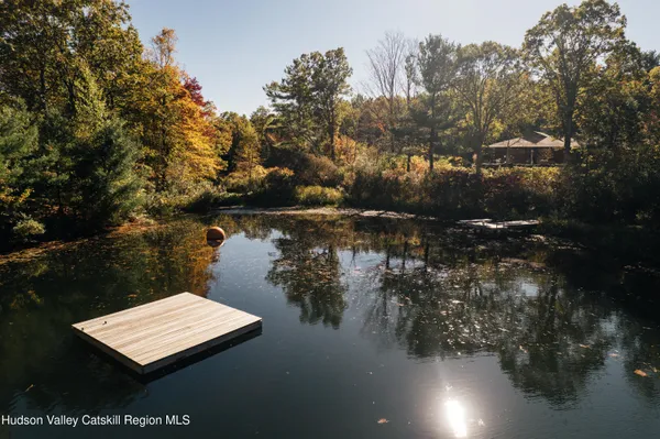 a view of a back yard of the green and green space