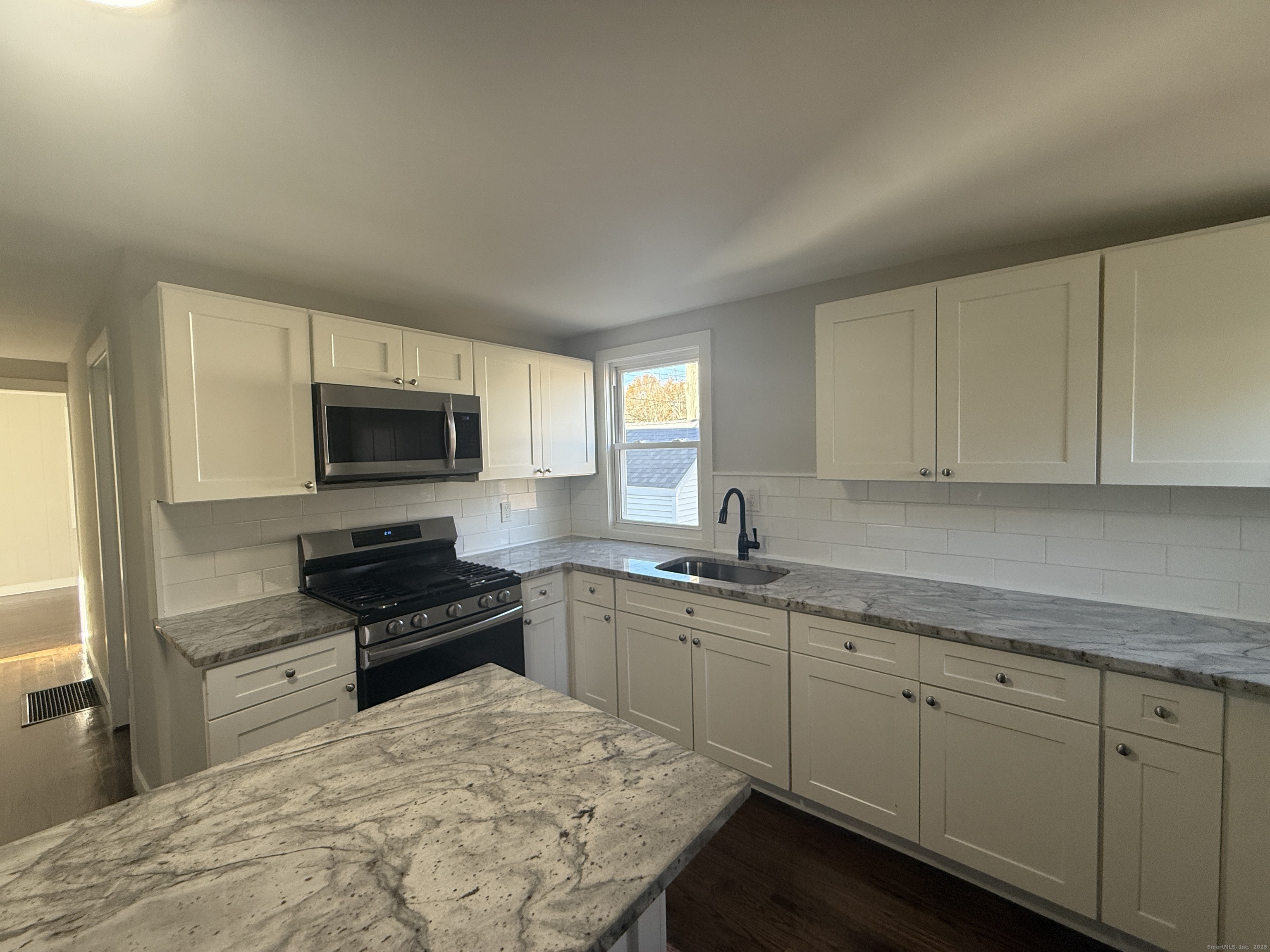 55 Ownly Avenue West Haven, CT 06516 - Photo 13 of 16 a kitchen with sink cabinets and appliances