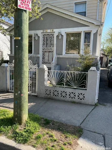 a view of a house with a bench in patio