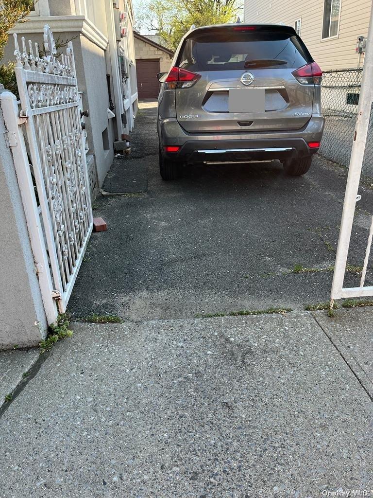 219-16 143rd Road Queens, NY 11413 - Photo 2 of 3 a view of car parking