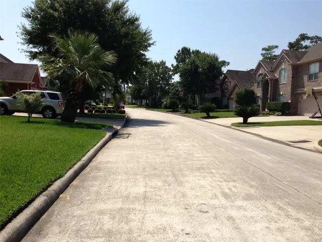 a view of street with parked cars