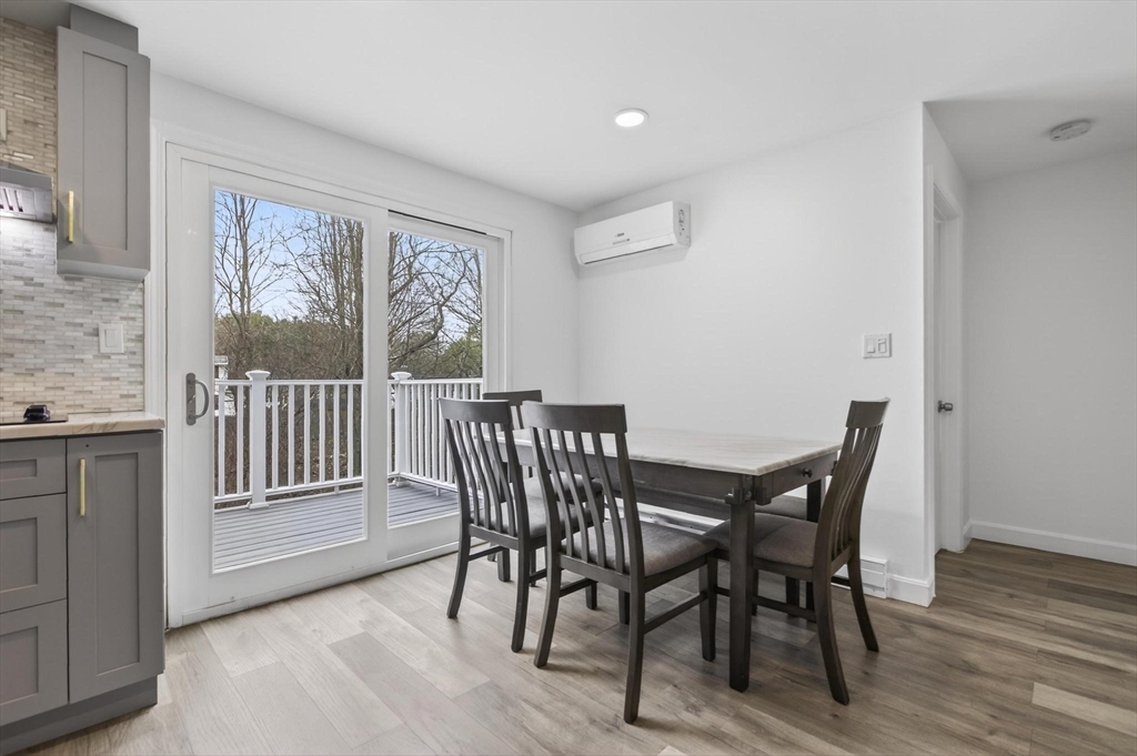 15 Cedar Square, Unit 15 Millis, MA 02054 - Photo 12 of 42 a view of a dining room with furniture window and wooden floor