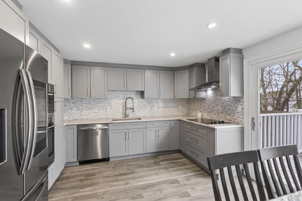 15 Cedar Square, Unit 15 Millis, MA 02054 - Photo 14 of 42 a kitchen with granite countertop a sink stainless steel appliances and cabinets
