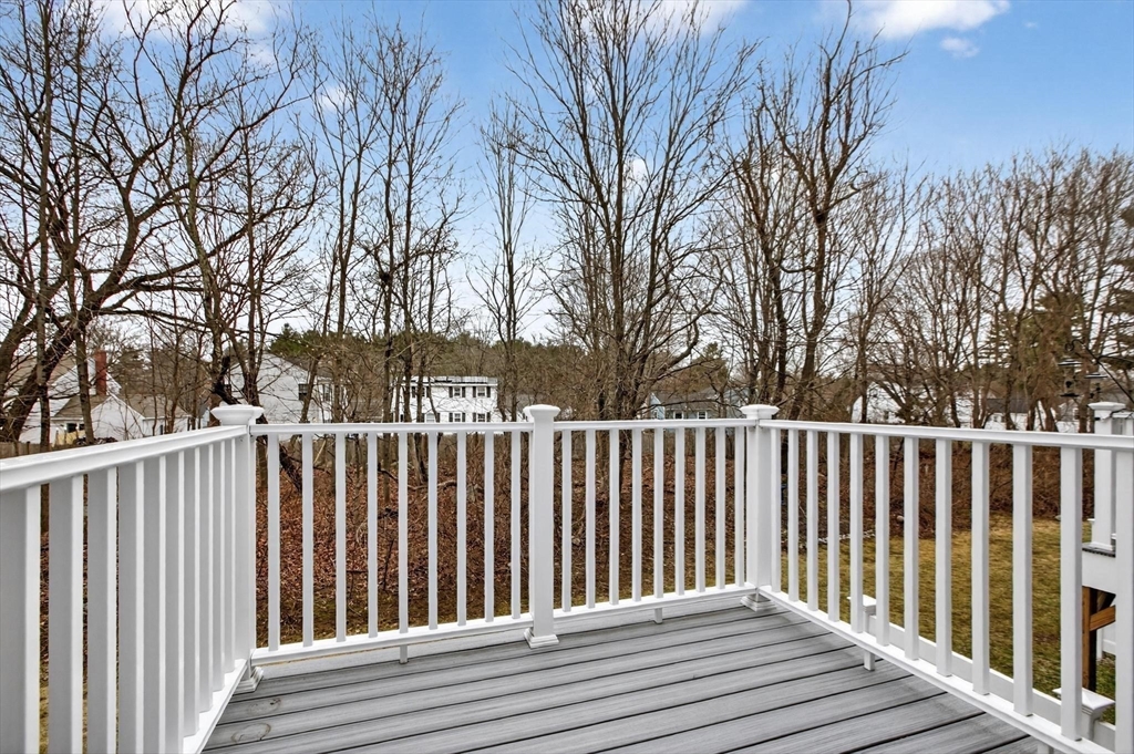 15 Cedar Square, Unit 15 Millis, MA 02054 - Photo 16 of 42 a view of wooden fence and trees
