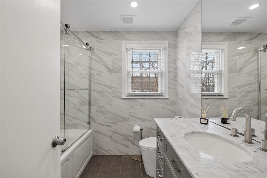 15 Cedar Square, Unit 15 Millis, MA 02054 - Photo 18 of 42 a bathroom with a granite countertop sink toilet and shower