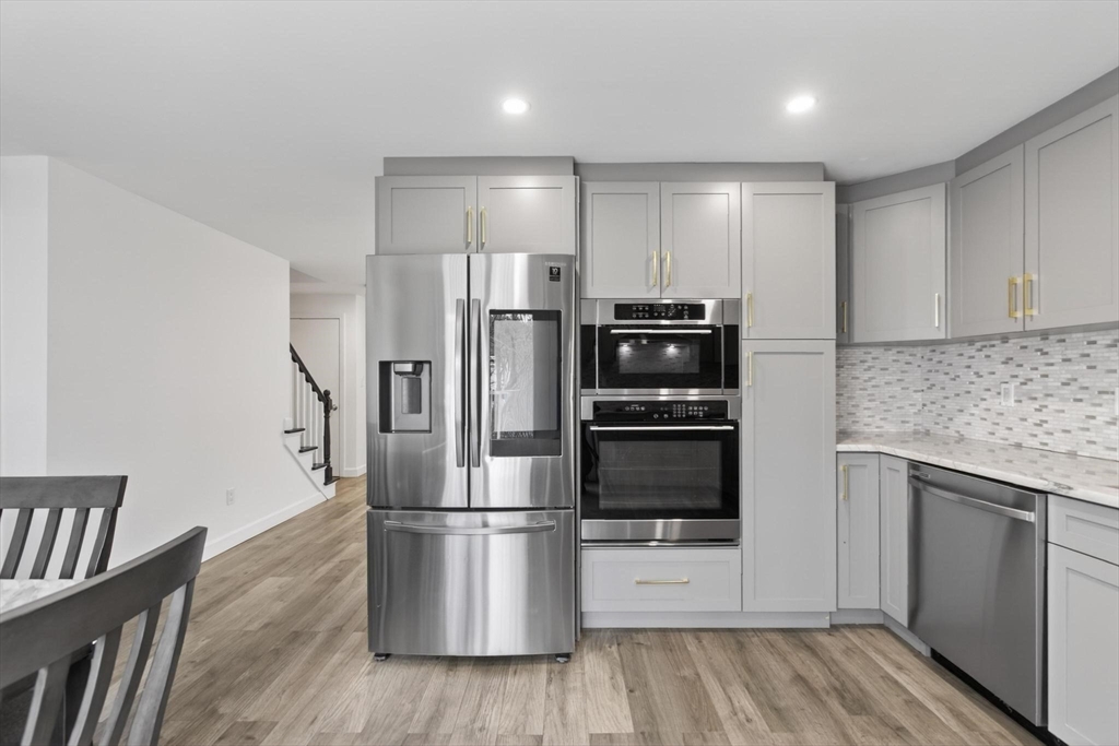 15 Cedar Square, Unit 15 Millis, MA 02054 - Photo 2 of 42 a kitchen with stainless steel appliances a refrigerator and a stove top oven