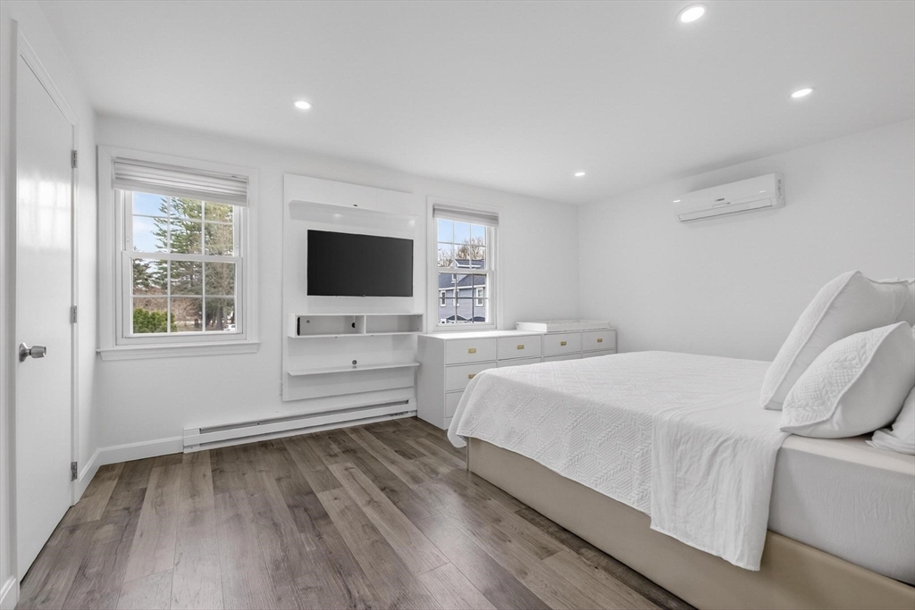 15 Cedar Square, Unit 15 Millis, MA 02054 - Photo 21 of 42 a bedroom with a bed and a flat screen tv