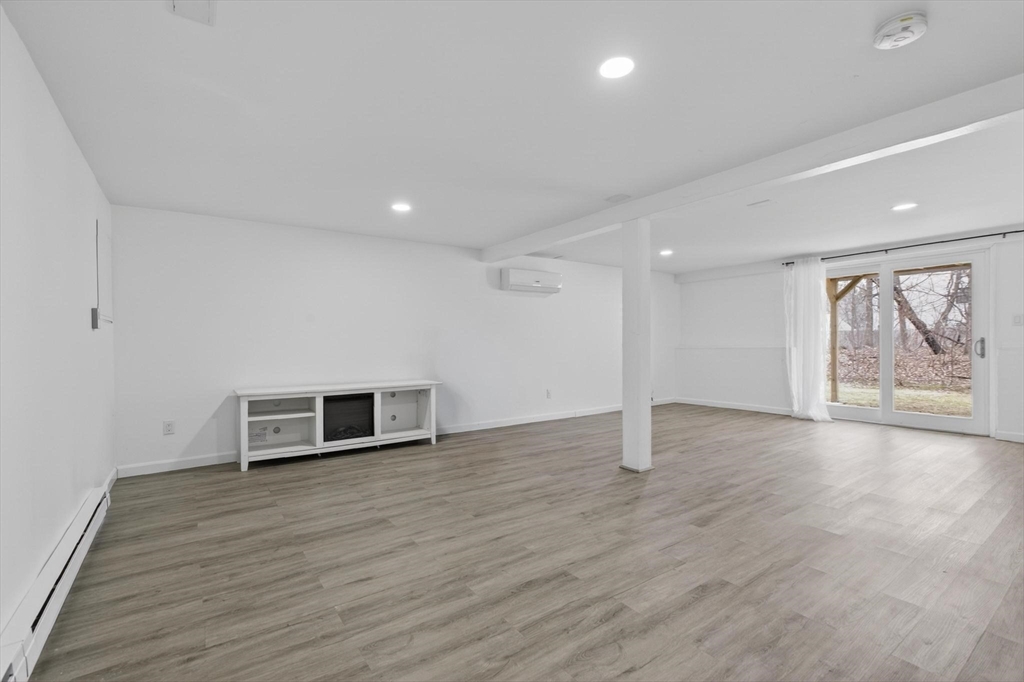 15 Cedar Square, Unit 15 Millis, MA 02054 - Photo 26 of 42 a view of a livingroom with wooden floor