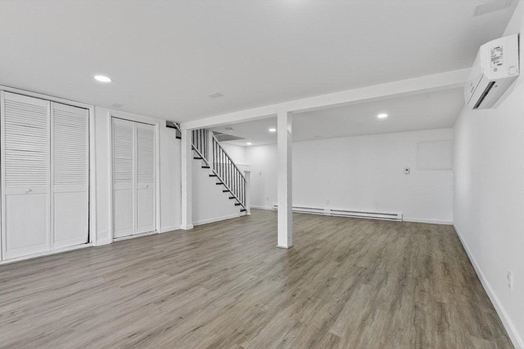 15 Cedar Square, Unit 15 Millis, MA 02054 - Photo 28 of 42 a view of an empty room with wooden floor