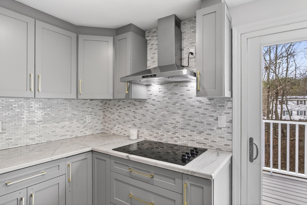 15 Cedar Square, Unit 15 Millis, MA 02054 - Photo 3 of 42 a kitchen with sink stove and cabinets