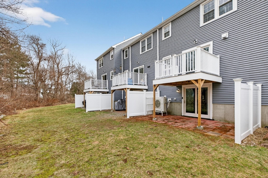 15 Cedar Square, Unit 15 Millis, MA 02054 - Photo 34 of 42 a front view of a house with a yard