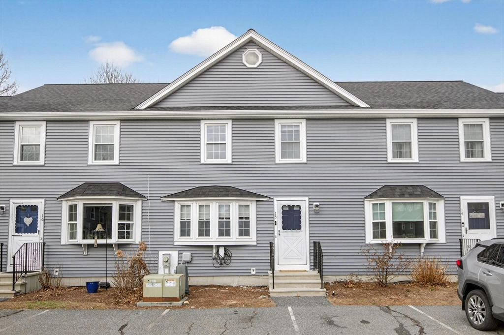 15 Cedar Square, Unit 15 Millis, MA 02054 - Photo 35 of 42 a front view of a house with a yard