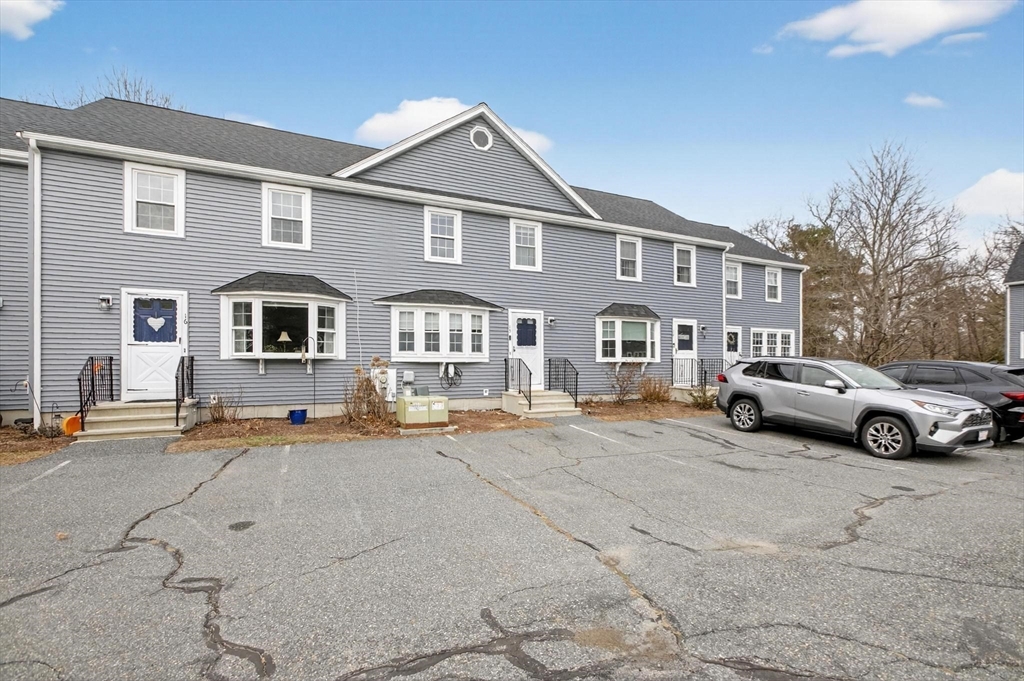 15 Cedar Square, Unit 15 Millis, MA 02054 - Photo 36 of 42 a view of multiple houses with a yard
