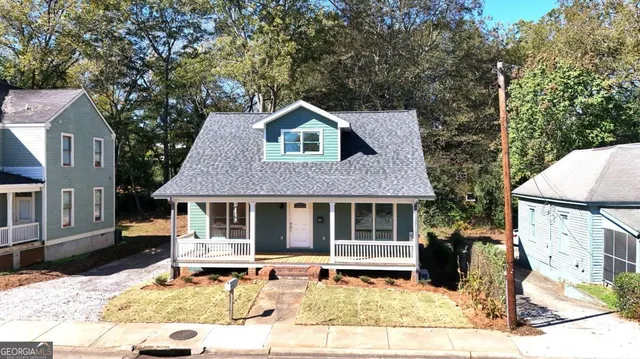 a house with trees in the background