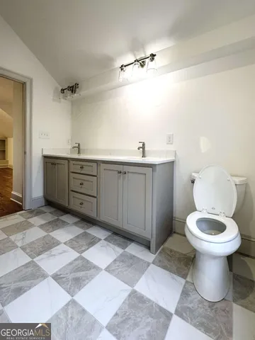 a bathroom with a sink and mirror