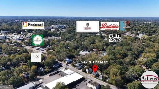 an aerial view of a house with a yard